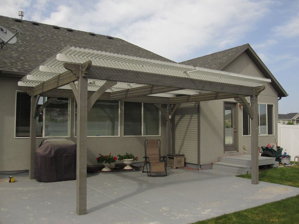 Timber frame pergola with louvered roof