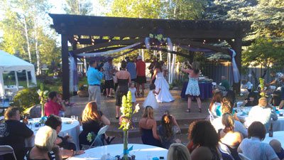 outdoor wedding under dovetail timber framed pergola