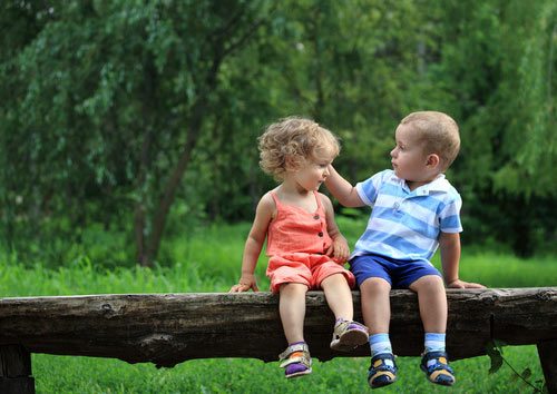 boy-and-girl-on-log