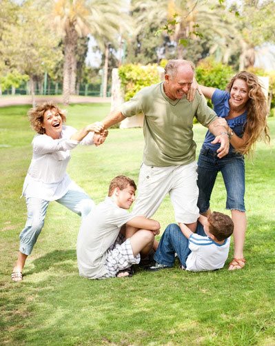 family-holding-back-grandfather-fun