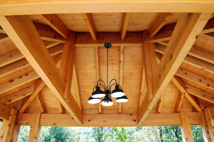 timber frame pavilion with outdoor lighting