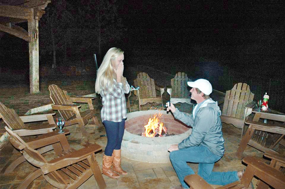 marriage proposal fire pit under a pergola kit