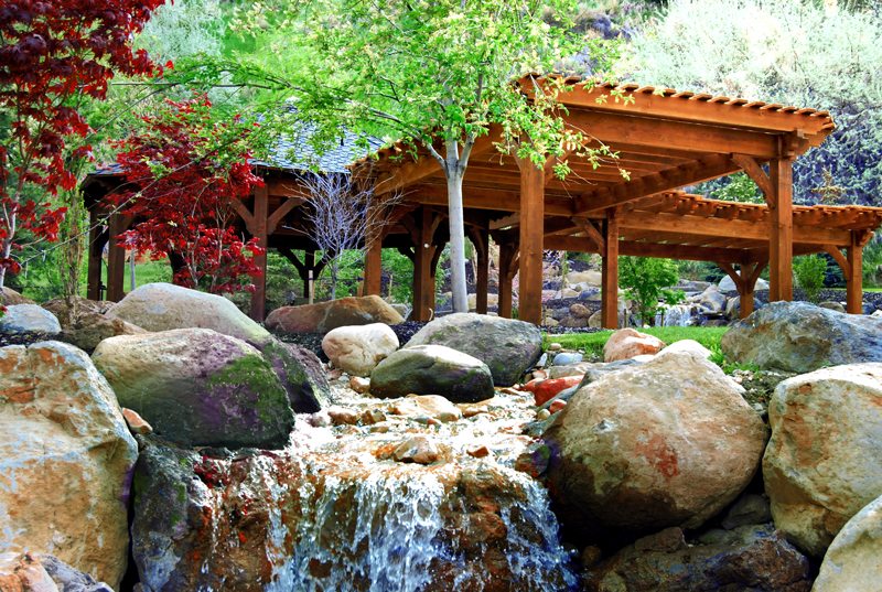 A solid wood timber framed gazebo with outdoor furniture