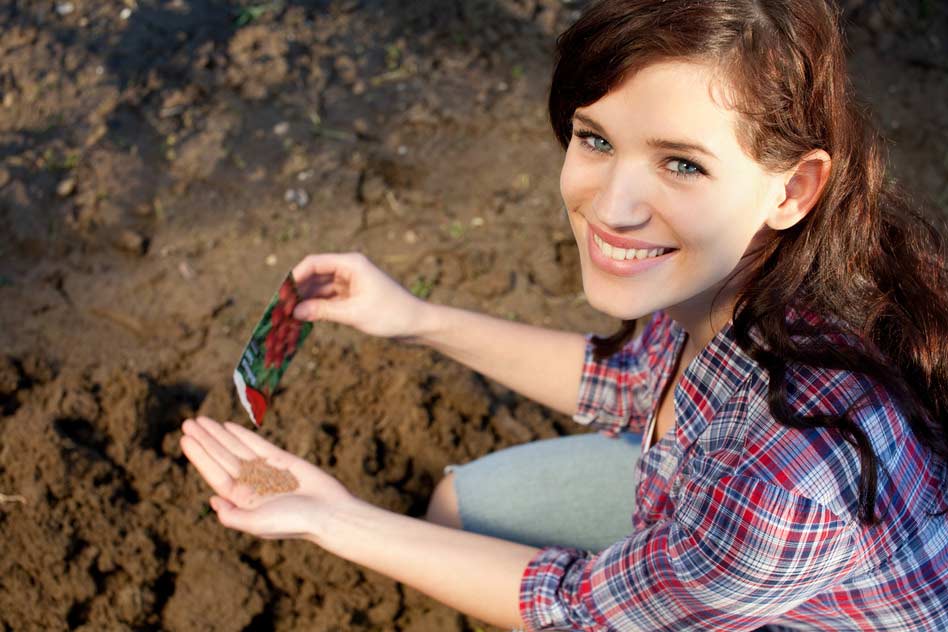 woman-with-seeds-in-her-hand organic garden plant seeds