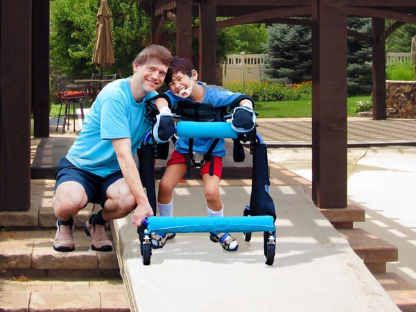 boy wheelchair under pergola