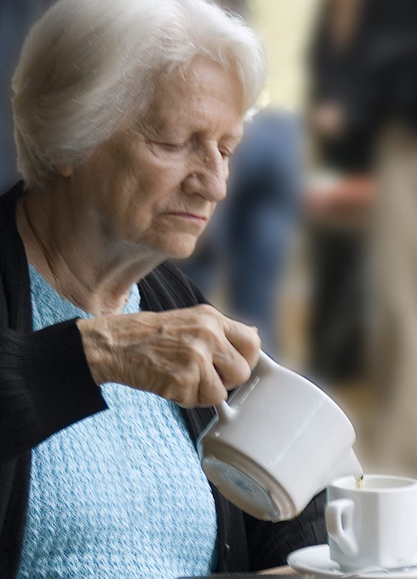 elderly-woman-pouring-tea
