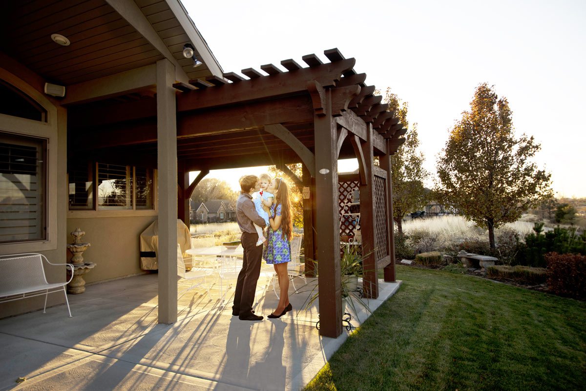 Sneddon-family-glow couple pergola baby