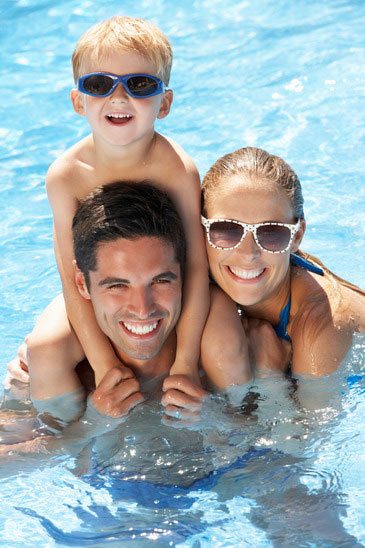 family-having-fun-in-swimming-pool-xs