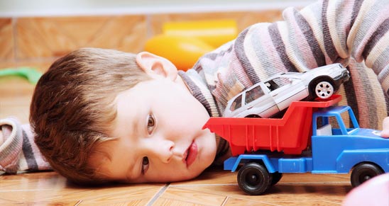 little-boy-playing-with-toy-car2 toy car truck boy
