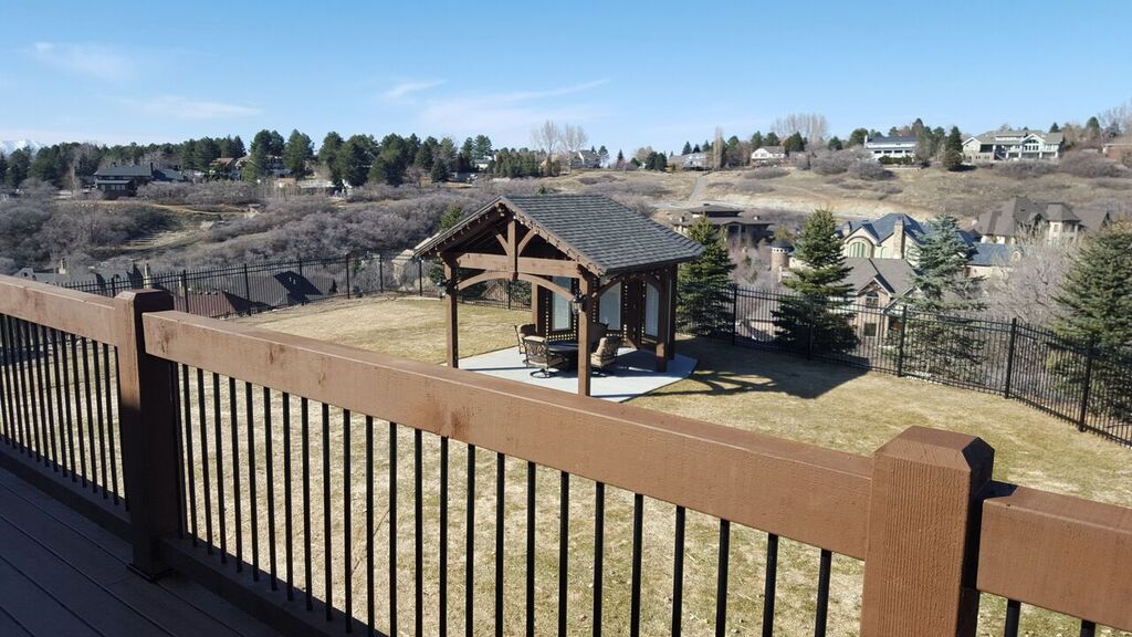 Deck overlooking timber frame pavilion gazebo