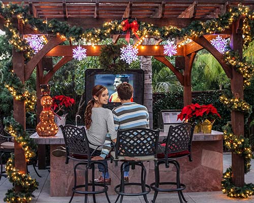 family enjoying timber pergola designs