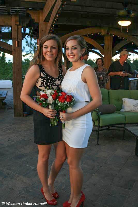 Girls pose beneath pergola
