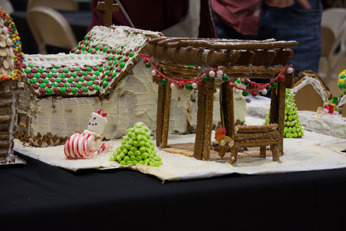 Pergola in backyard of gingerbread house