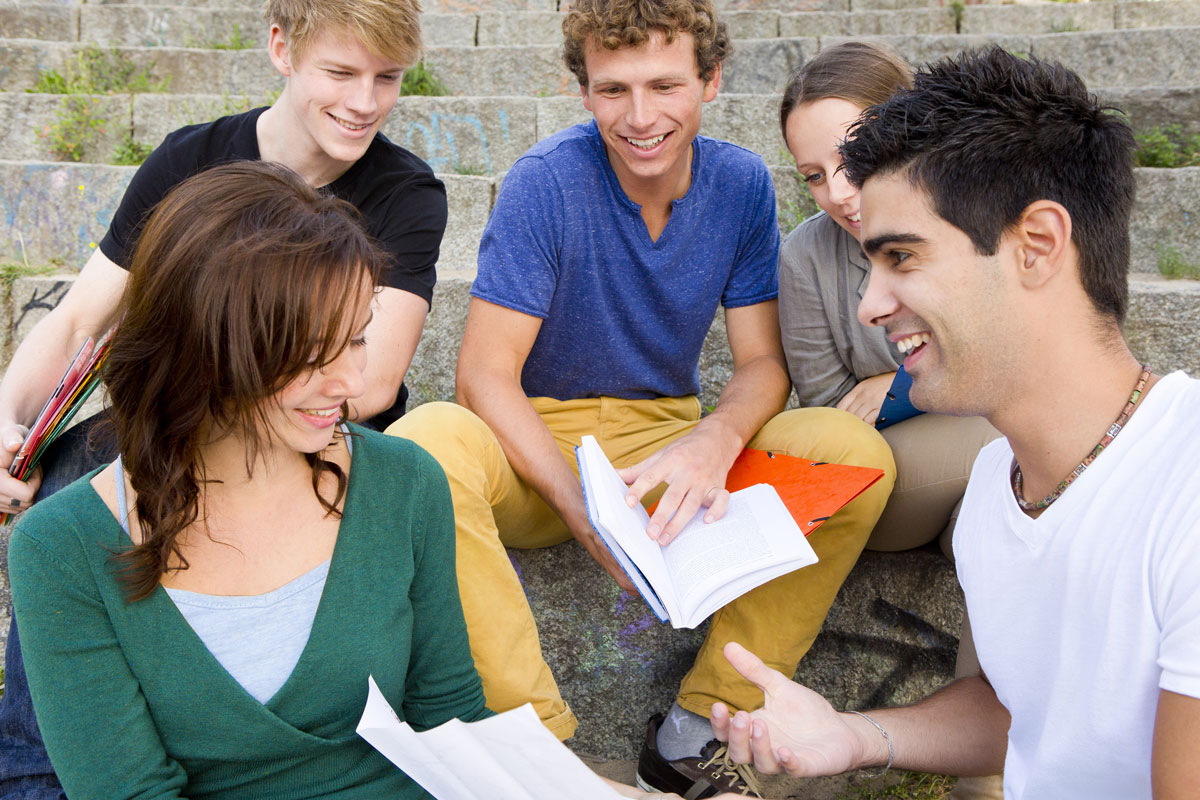 teenagers-playing-outdoor-fictionary-game dictionary fictionary game