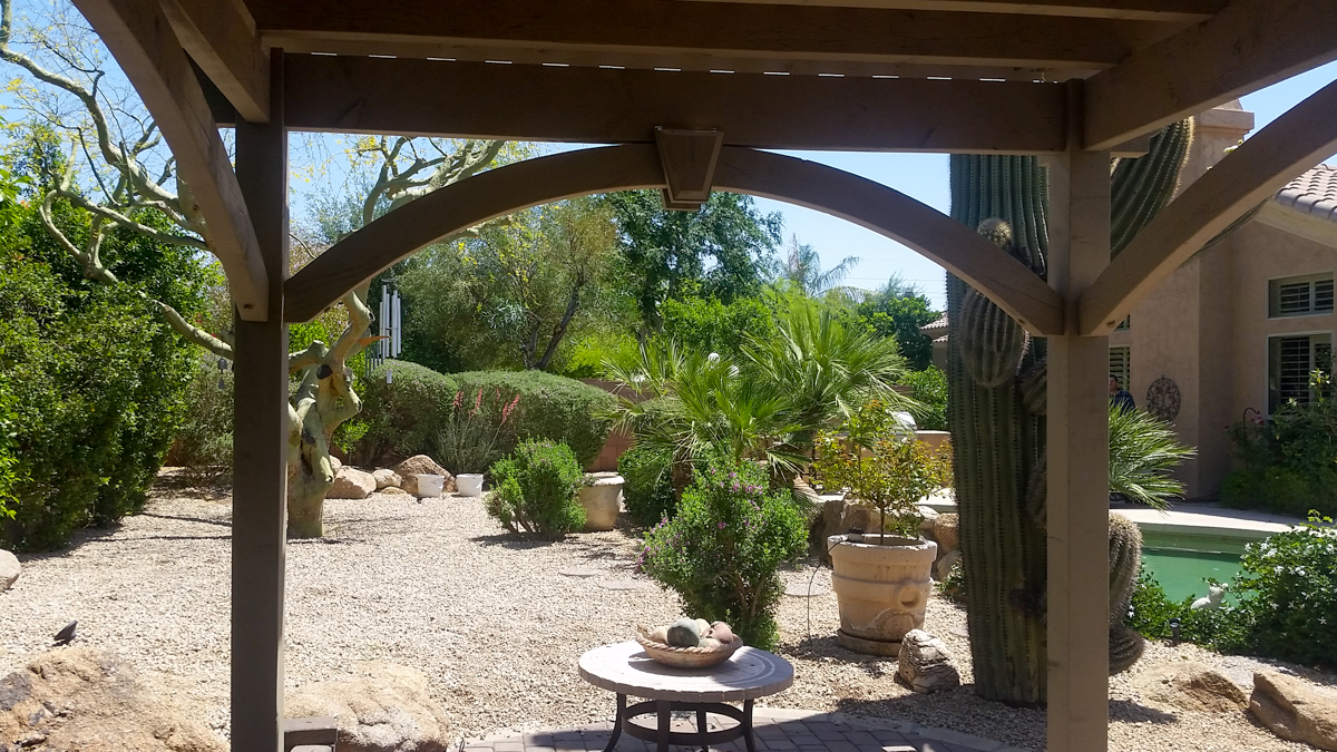Beneath a timber frame pergola kit
