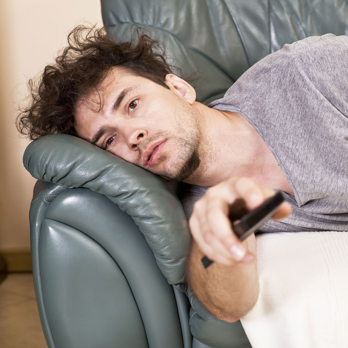 bored-man-watch-tv-remote