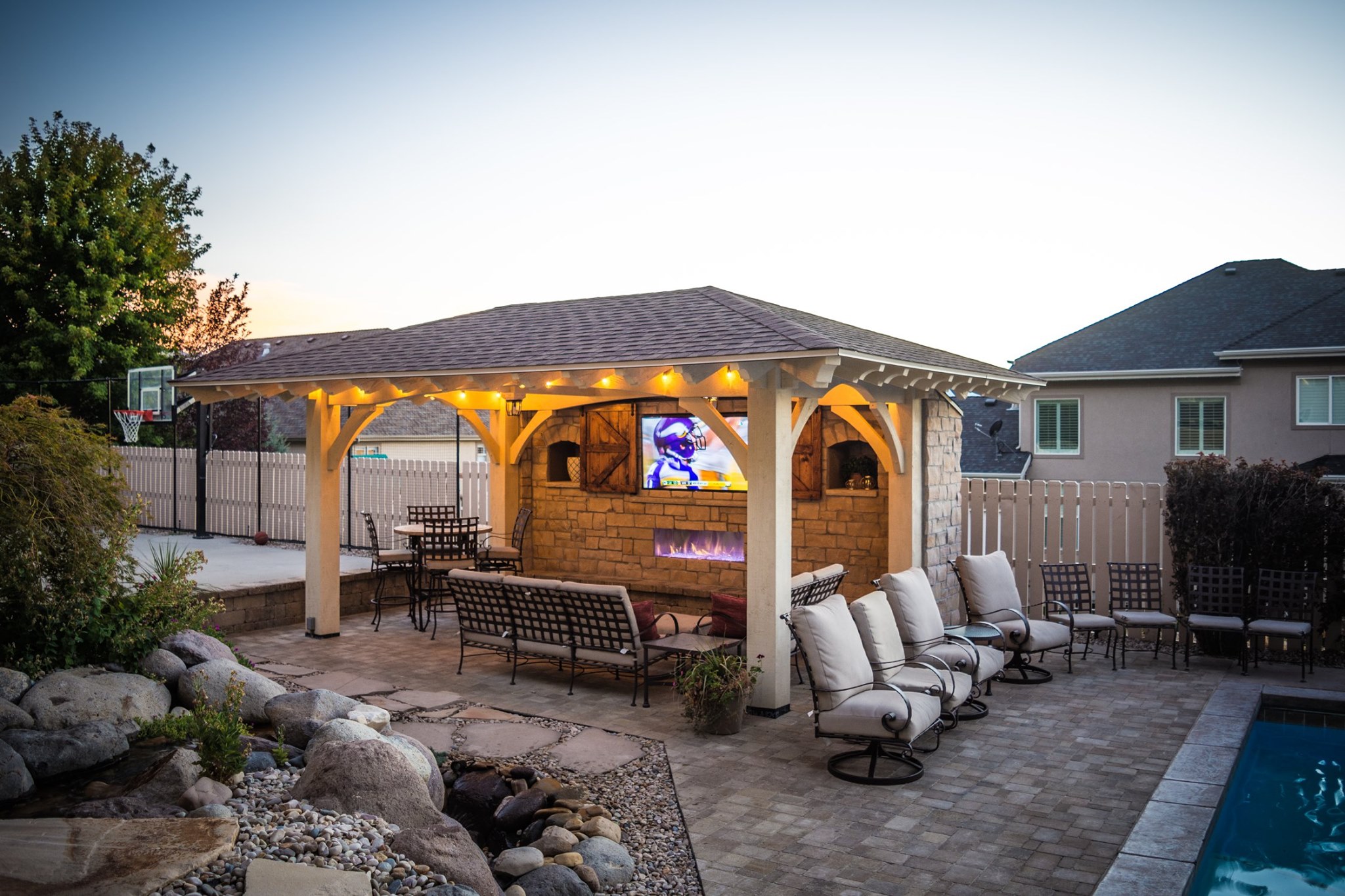 pavilion kit with tv and pool outdoor dining