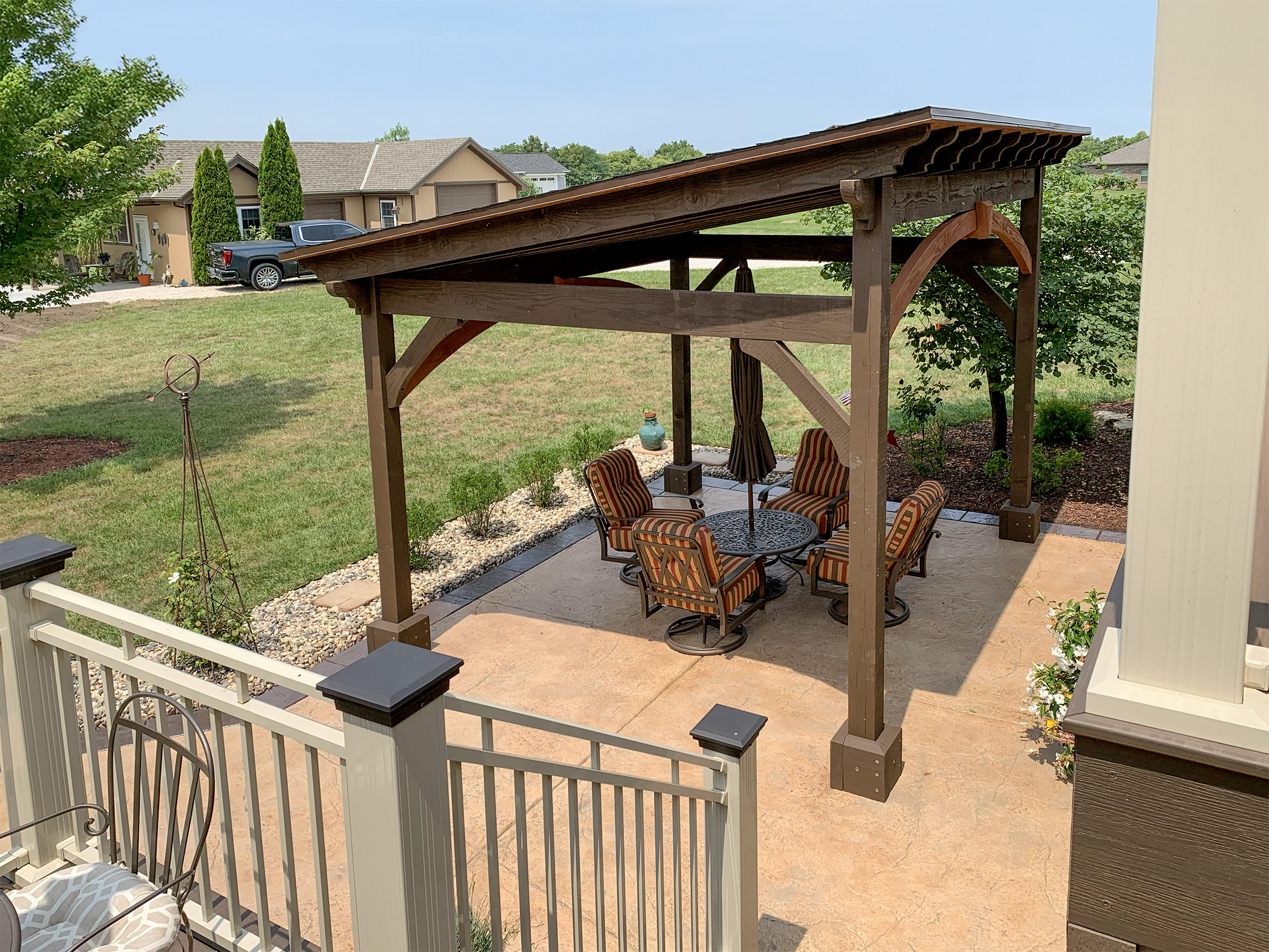 DIY timber frame cabana with shed-style roof and capped posts in Kingsville, Missouri backyard