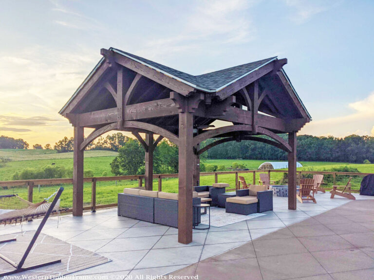 Timber frame pavilion kit with three gable roofs, handcrafted in Douglas Fir for a residential outdoor living space.