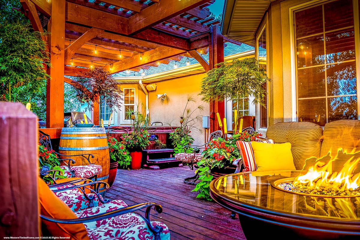 cozy backyard patio with timber pergola fire pit hot tub and lush plants