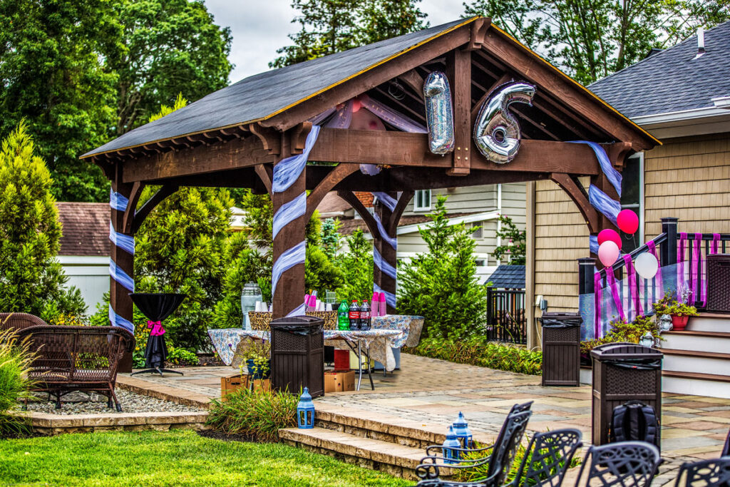 Western Timber Frame pavilion decorated with birthday decorations for an outdoor celebration.