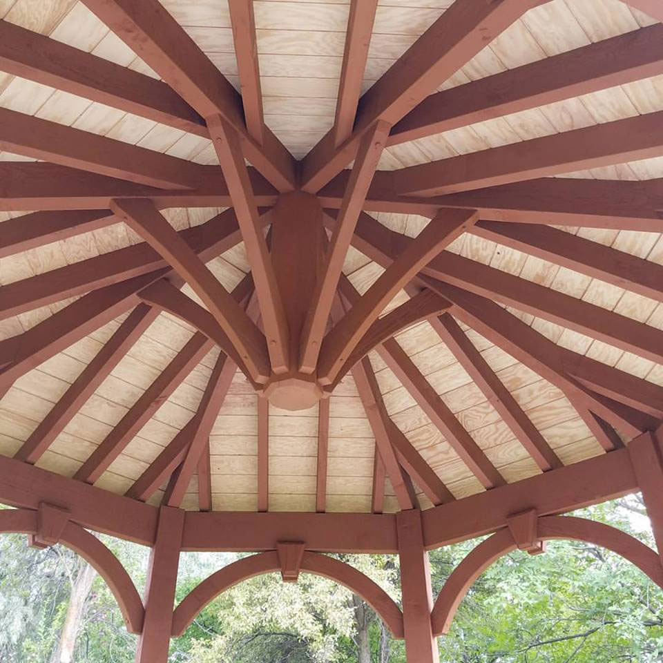 Underneath view of timber frame gazebo ceiling with natural and rich Sequoia wood stains by Western Timber Frame