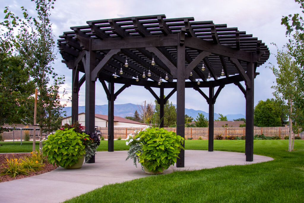 Timber frame pergola with round roof design by Western Timber Frame