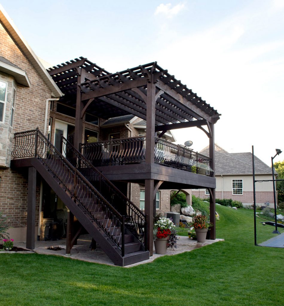 Timber frame pergola with stepped roof covering a two-story deck by Western Timber Frame