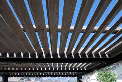 Louvered timber frame shade planks on a pergola roof by Western Timber Frame