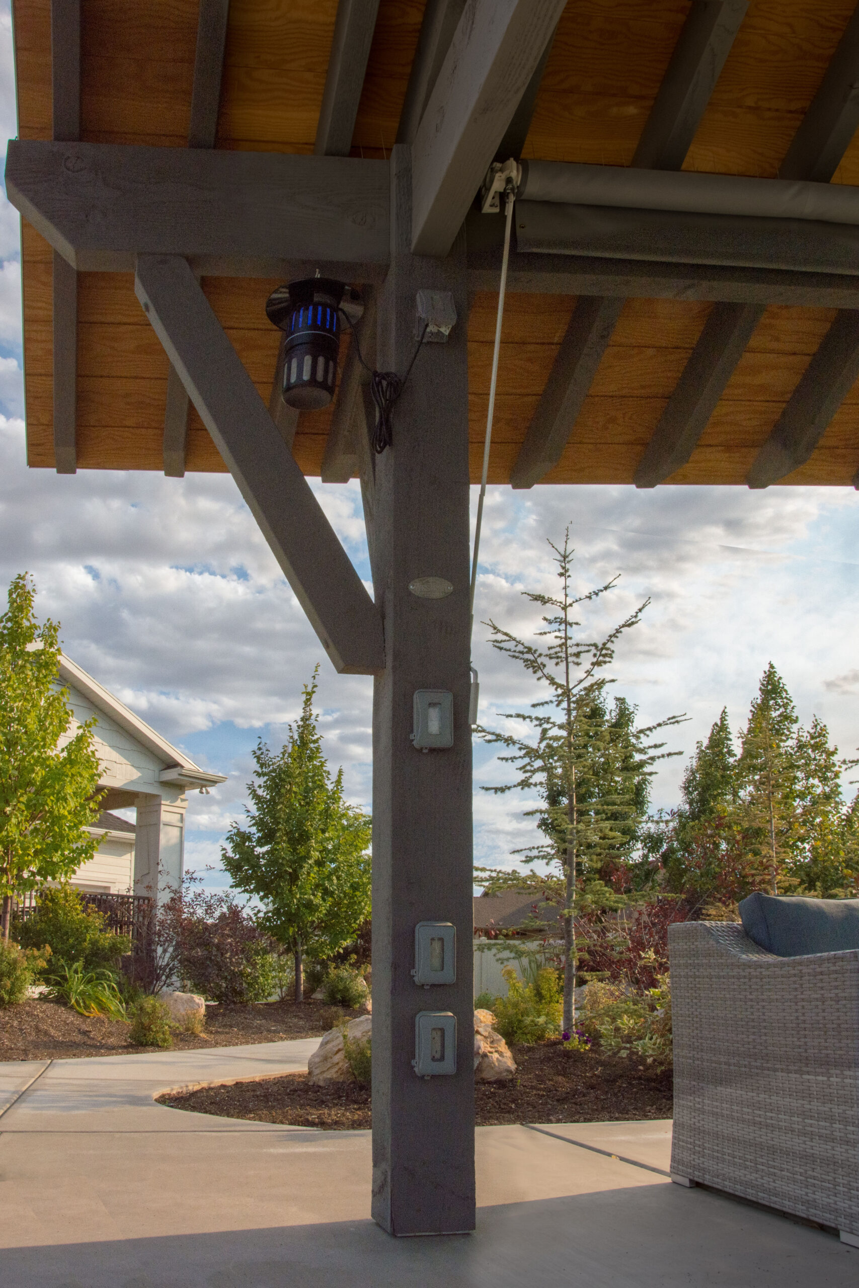 TimberVolt power post with integrated switches under pavilion roof
