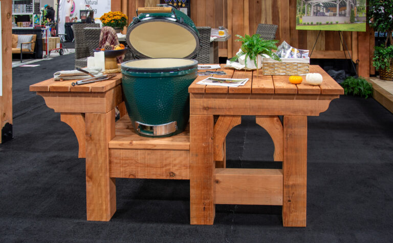 Redwood timber grilling table with a Big Green Egg grill, custom-built for outdoor cooking and entertaining.