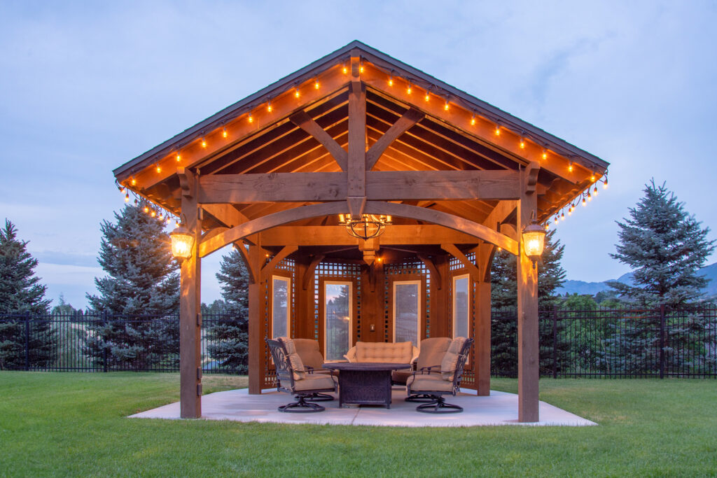 TimberVolt®-powered timber frame gavilion with string lights and chandelier